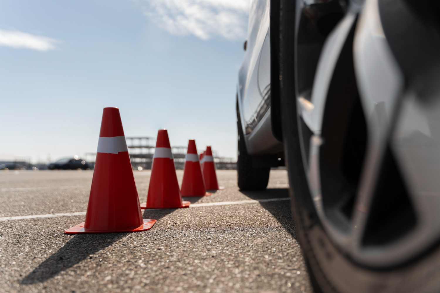 safety cones next to vehicle wheels